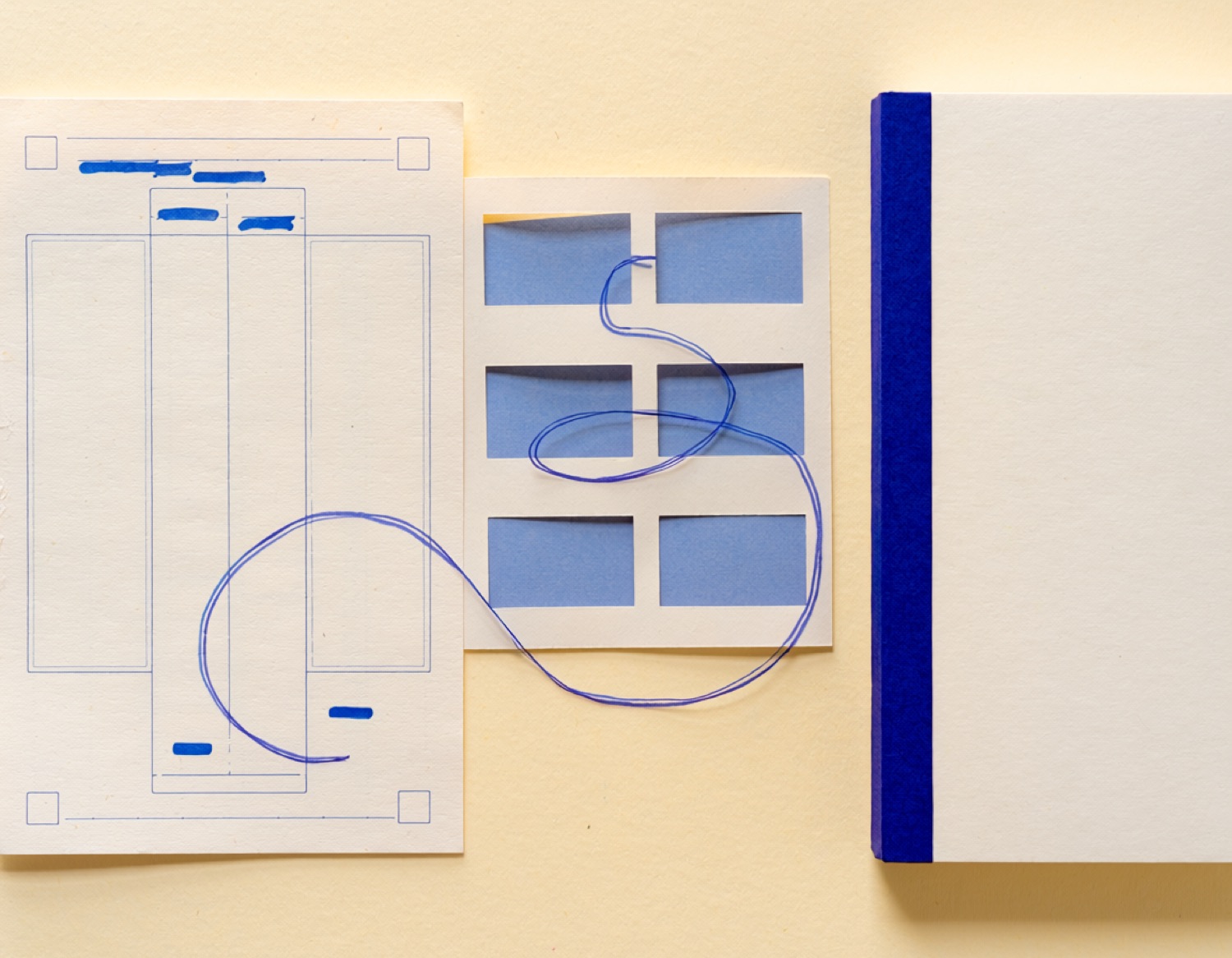An ordering document, rules stencil and bound ledger connected by one continuous ultramarine line